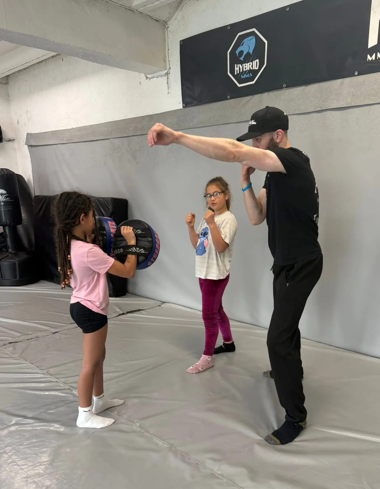 Kids MMA girls padwork with Coach Jordan